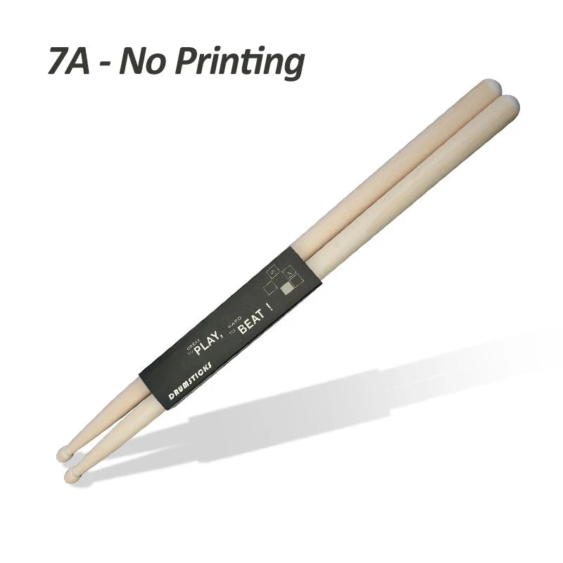 A pair of light wood drumsticks with black markings for playing and beating
