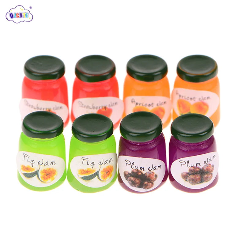 A set of five miniature ceramic jam jars in various fruit flavors including strawberry, apricot, and plum.