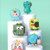 A collection of cute, shaped animal backpacks and water guns for kids, including a blue elephant, green dinosaur, and yellow 