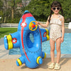 A young girl holds a blue inflatable aircraft swim ring for kids outdoors.