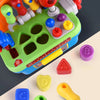 A bright green toy drill set with various colored tools and components, including a screwdriver and a measuring tape.