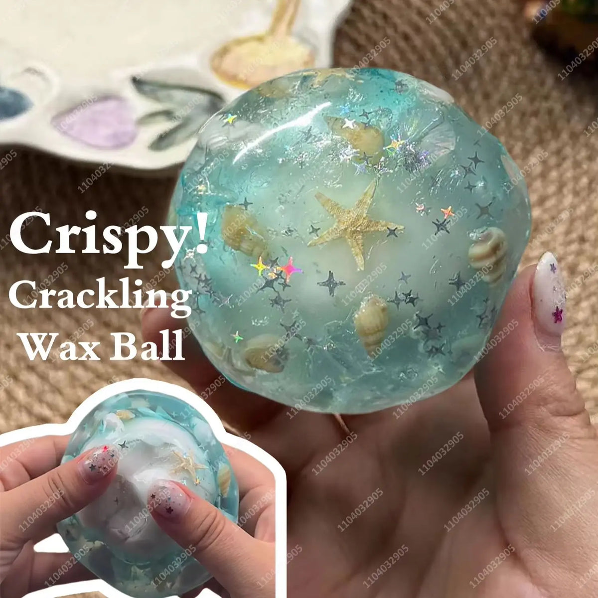 A hand holds a clear, sparkling blue wax ball with gold glitter and stars for ASMR crunchy stress relief.