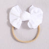 White soft elastic hair bands tied in a bow for girls