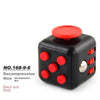 Black decompression die with red dots and a red top, used for stress relief.