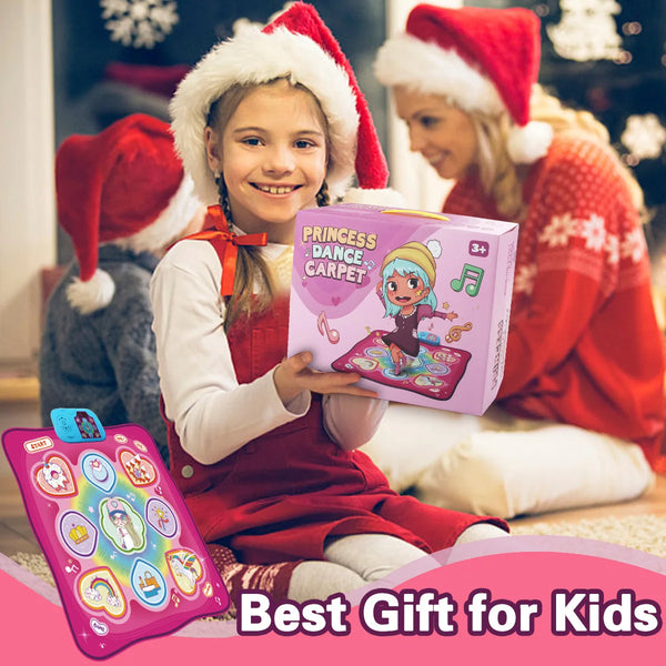 A girl holds an interactive dancing blanket product in front of a woman and a Christmas tree.