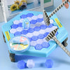 A blue hexagonal game board with purple and white pieces, including a penguin figure and tapping tools.