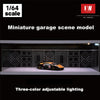A miniature garage scene model featuring a die-cast car displayed in an acrylic showcase with three-color adjustable lighting