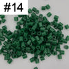 A pile of 1000 assorted green fuse beads for creative craft projects.