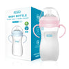 A clear baby bottle with a pink lid and handle is shown next to its packaging box.