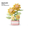 A set of 367 plastic building blocks shaped like yellow sunflowers arranged in a pink rectangular planter.