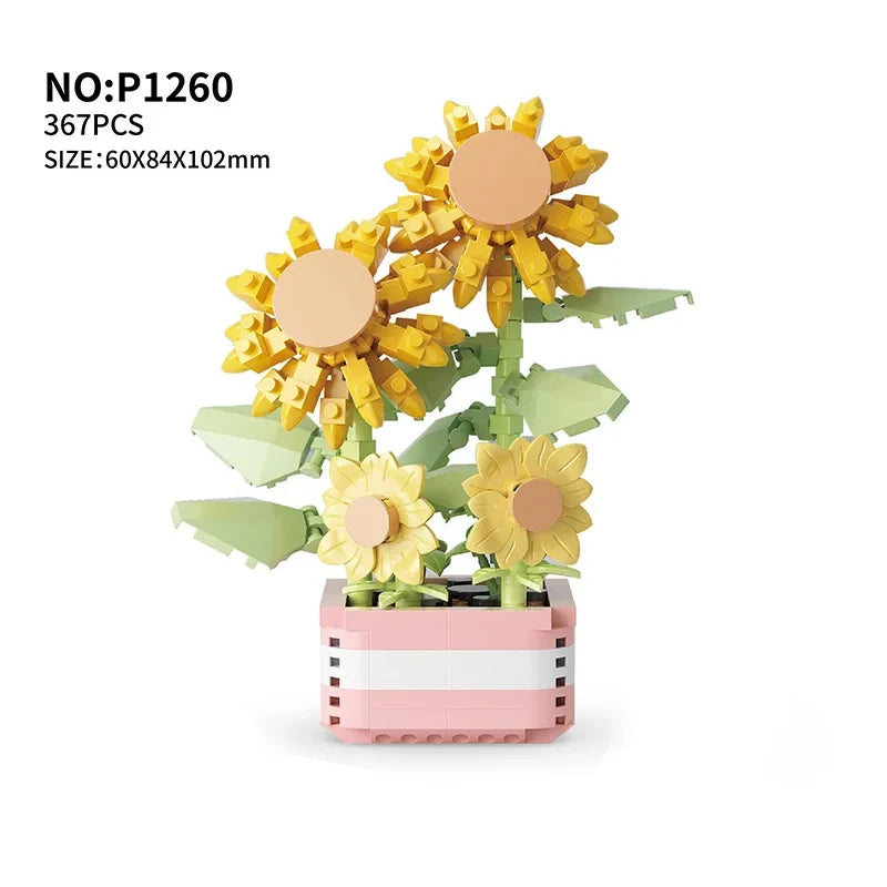 A set of 367 plastic building blocks shaped like yellow sunflowers arranged in a pink rectangular planter.