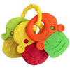 A colorful silicone baby teether featuring multiple rings and shapes in yellow, orange, and green.
