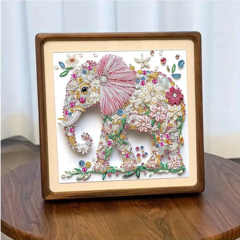 Diamond painting kit featuring an elephant adorned with flowers and sparkling details in a wooden frame.