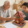 An elderly man and a young man are assembling a wooden cuckoo clock puzzle kit on a table.