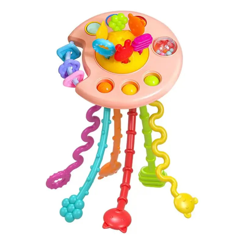 A pink baby pull-string sensory toy with silicone teether featuring colorful fruit shapes.