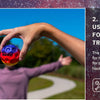 A hand is tossing a blue moon ball during outdoor sports training.