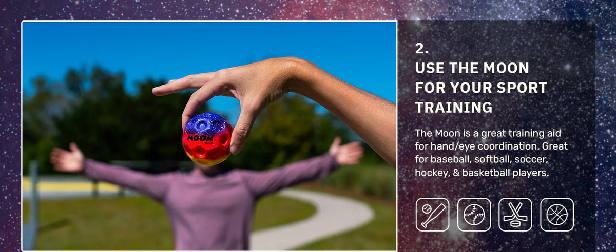 A hand is tossing a blue moon ball during outdoor sports training.