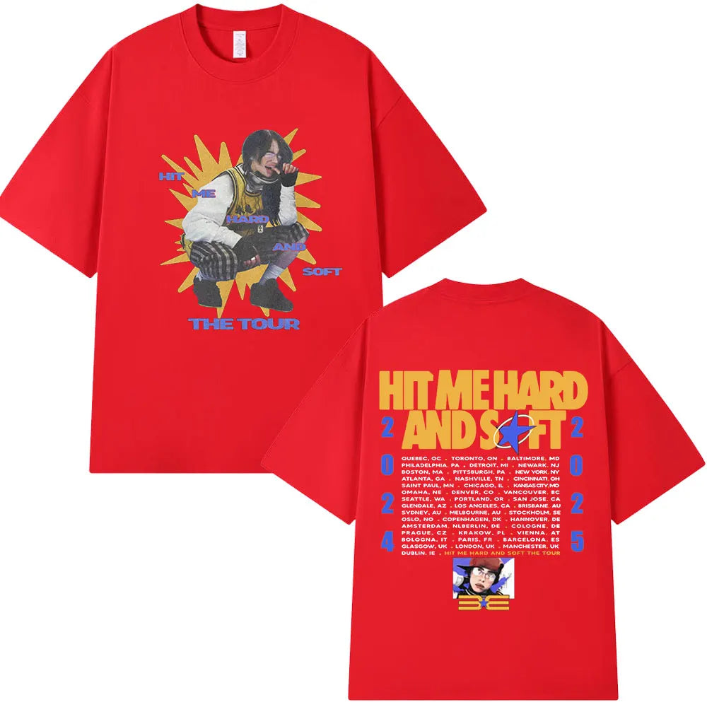 A red t-shirt featuring a graphic of a musician and the text HIT ME HARD AND SOFT TOUR