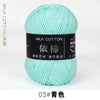 A ball of light mint green milk cotton yarn for knitting and crochet