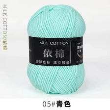 A ball of light mint green milk cotton yarn for knitting and crochet