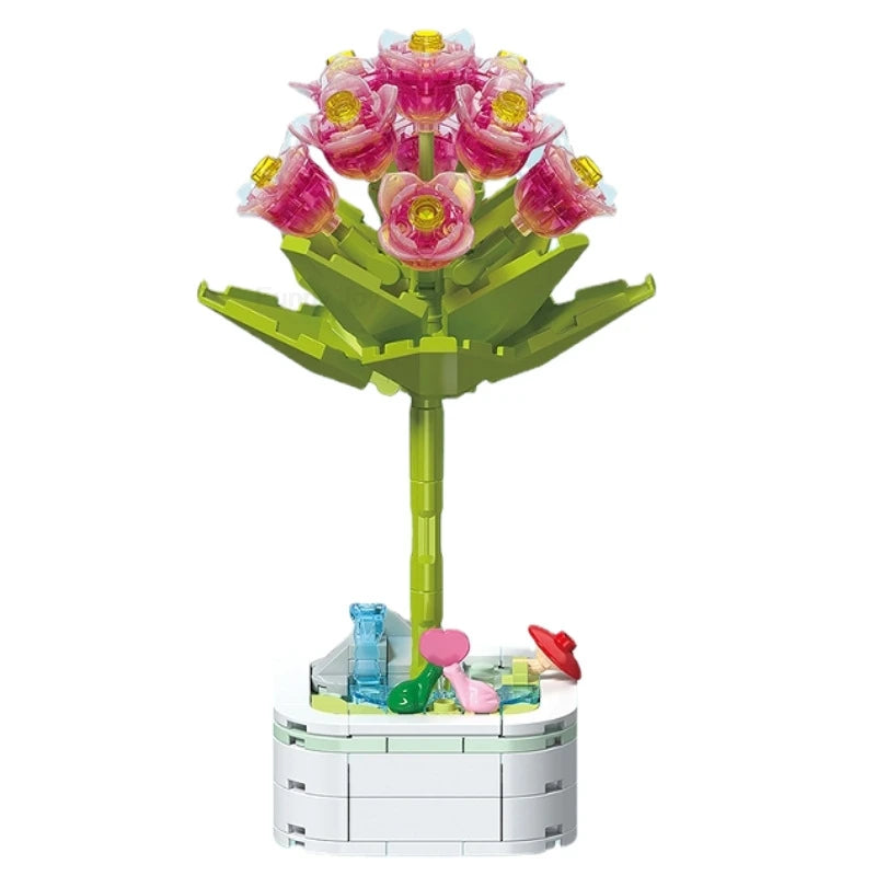 A green building block bouquet set featuring pink and purple rose flowers and various accessories.