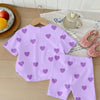 A lavender two-piece summer set for girls featuring a heart print top and shorts.