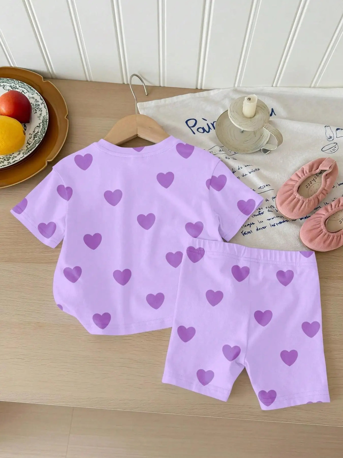 A lavender two-piece summer set for girls featuring a heart print top and shorts.