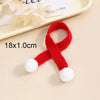 A red knitted Christmas hat or scarf with white pom-poms shown on a light background.