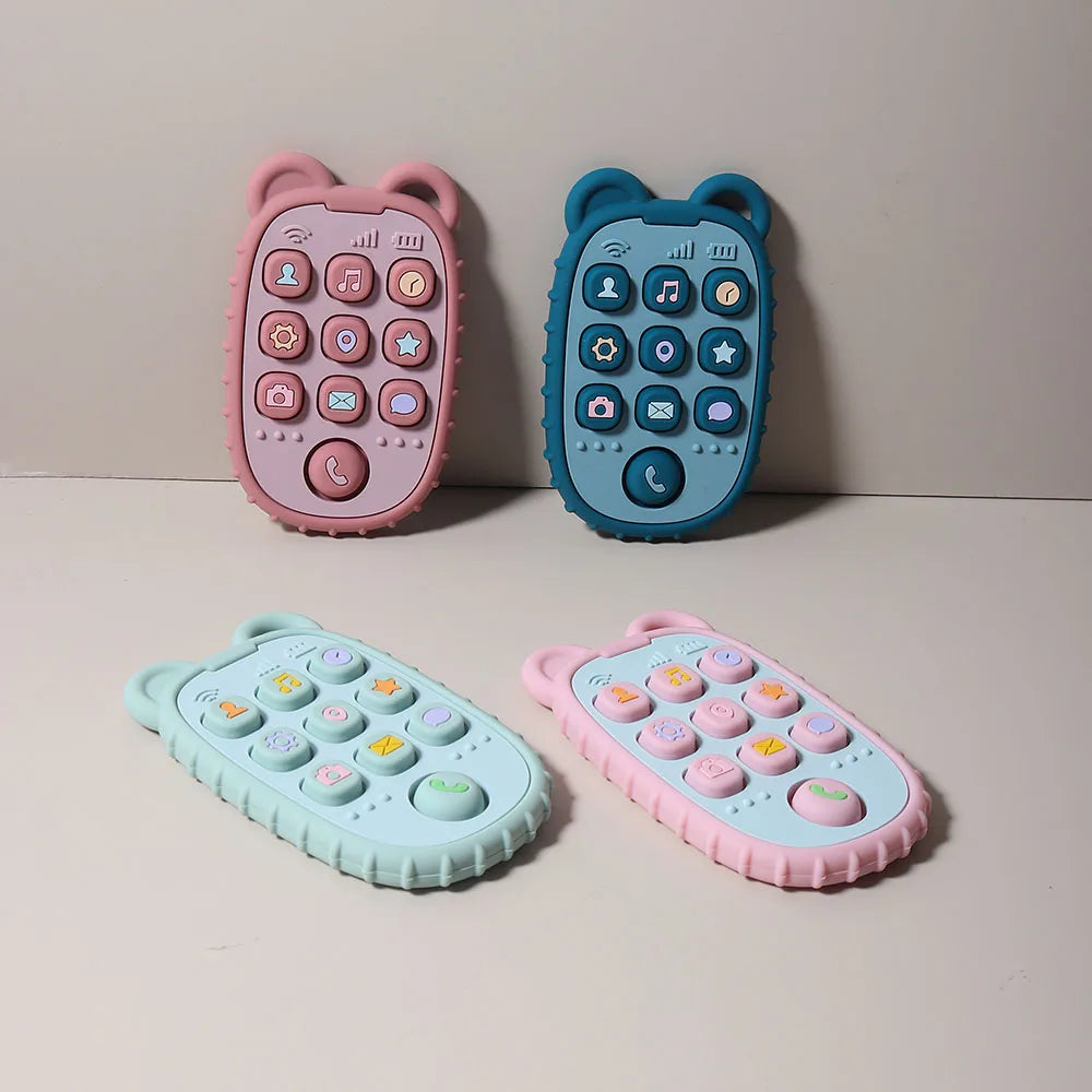 Two phone-shaped silicone teethers in pink and blue are displayed on a light background.