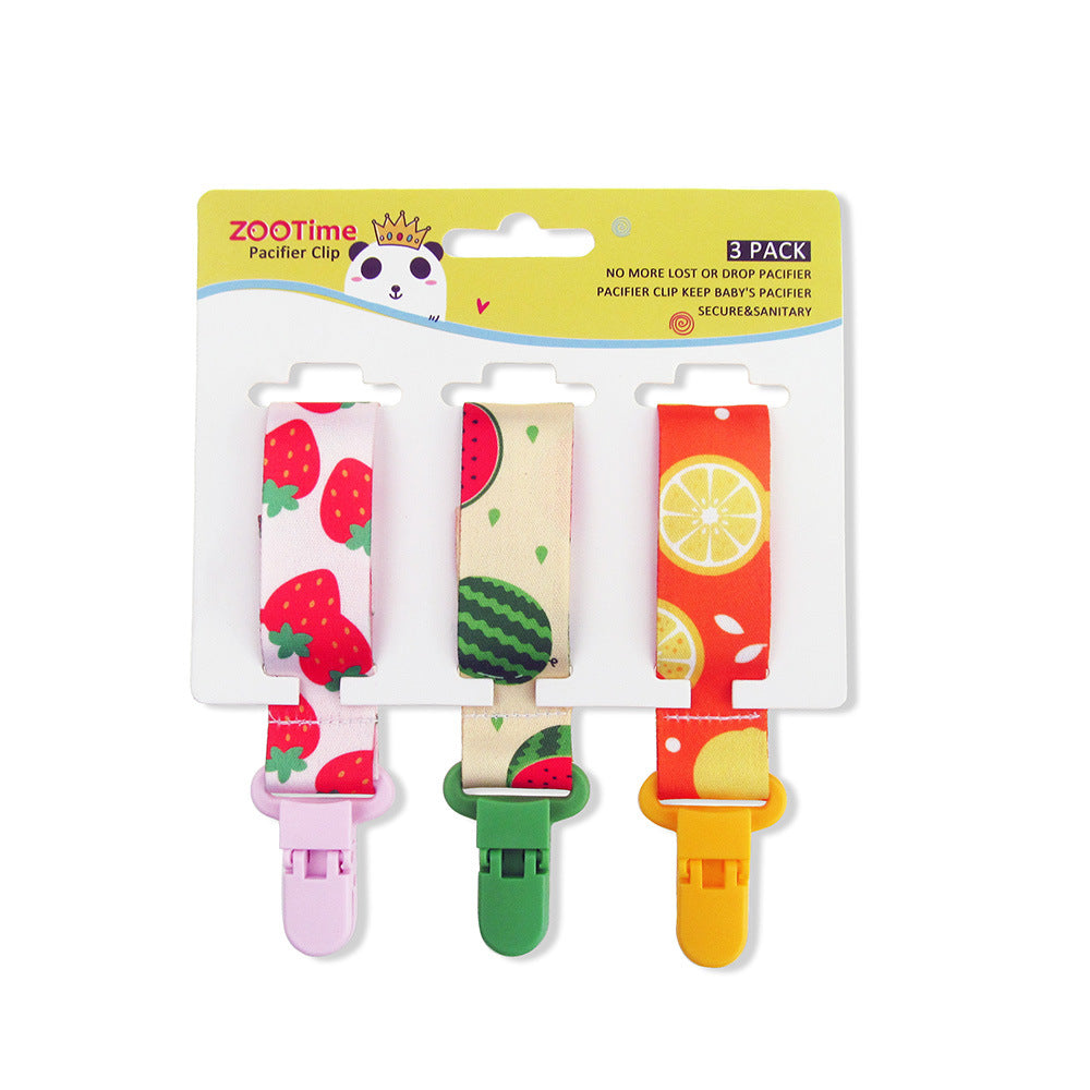 Set von drei bunten Silikon-Pacifier-Clips mit Erdbeere-, Limette- und Wassermelonen-Designs.