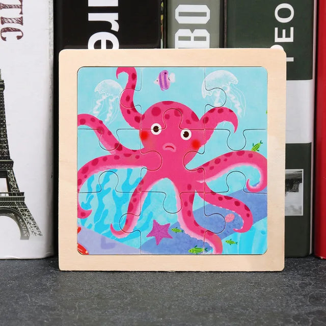 A wooden tangram puzzle featuring a pink octopus design on a light blue background.