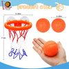 An orange basketball hoop set with a net and three orange balls shown next to a hand for size reference.