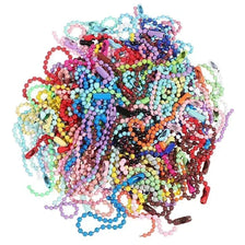 A colorful pile of ball bead chains in various bright colors like pink, blue, green, and red.