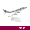 Diecast model of a Qatar Airways airplane in silver and white.