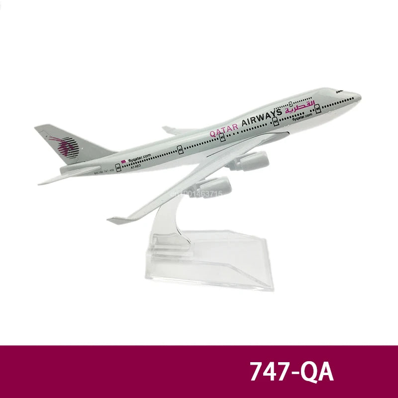 Diecast model of a Qatar Airways airplane in silver and white.
