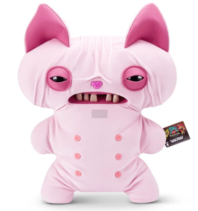 A pink plush monster toy with large ears and a funny grin is shown from the front.