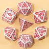 A collection of seven white and red carved polyhedral dice set for tabletop role-playing games