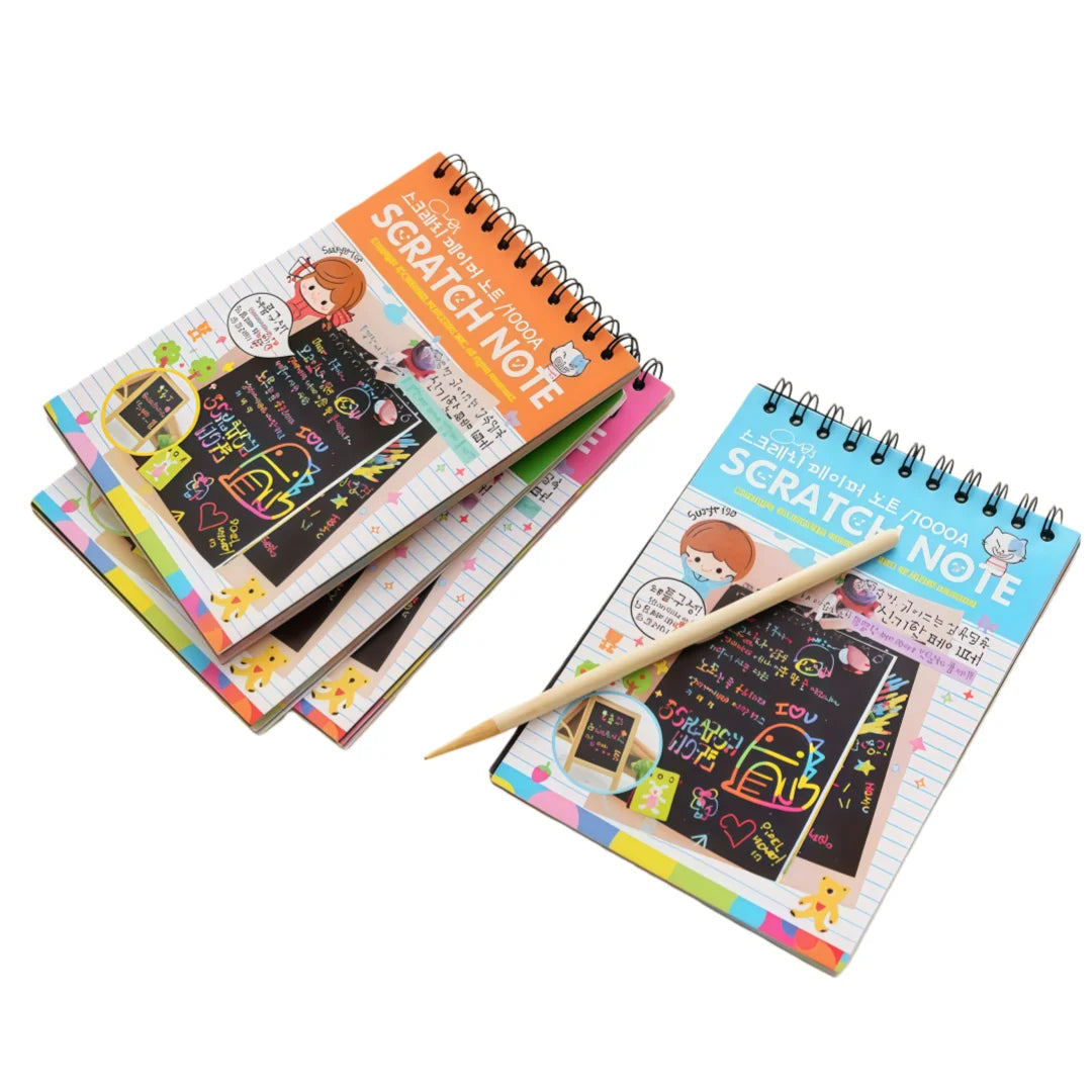 A stack of colorful scratch art notebooks with decorative covers and pencils.