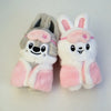 A pair of cute cartoon animal plush keychains featuring a gray bear and a white rabbit with pink accents.