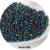A pile of iridescent, metallic glass beads in various shades of blue and purple.