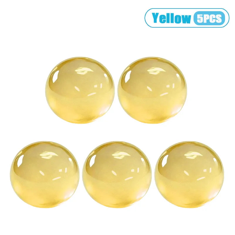 Five yellow silicone stress relief balls for massage and relaxation