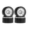 A pair of black beadlock wheels with a silver hub and removable hex hub for an RC crawler.