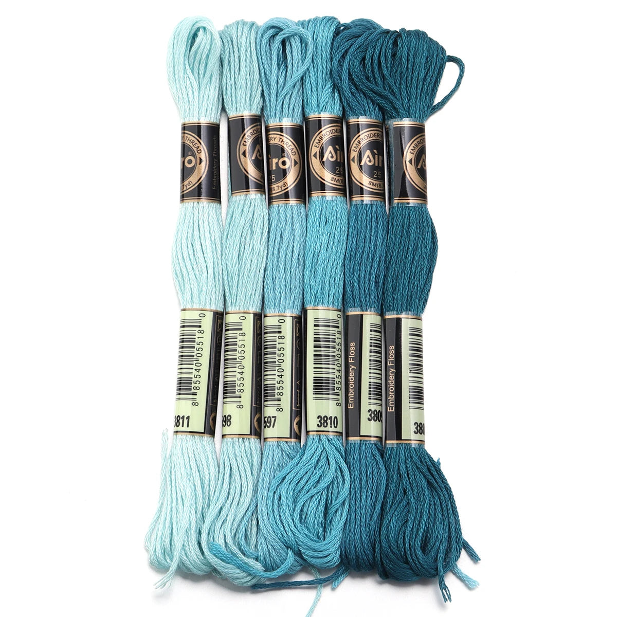 A set of six skeins of vibrant embroidery thread in various shades of teal and blue for cross stitch and DIY crafts
