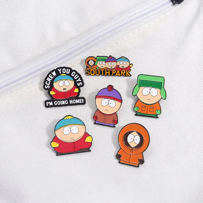 A set of enamel pins featuring characters from South Park, including Cartman and Stan.