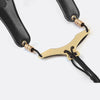 A black adjustable PU leather saxophone shoulder strap with gold accents.
