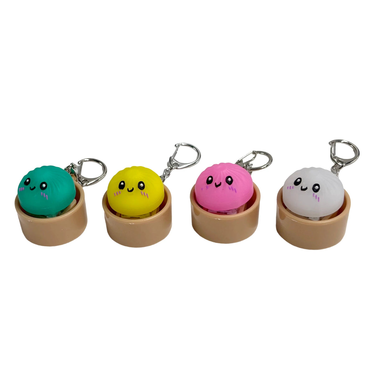Four colorful dumpling stress relief keychains in light wood with metal clasps