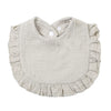 A light beige ruffled muslin cotton baby bib with an adjustable snap closure.