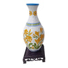 Blue and white porcelain flower vase puzzle featuring yellow floral designs on a stand