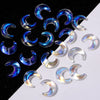 A collection of iridescent blue and purple moon-shaped glass beads for DIY jewelry making