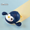 A blue penguin bath toy with yellow accents is shown against a light background.